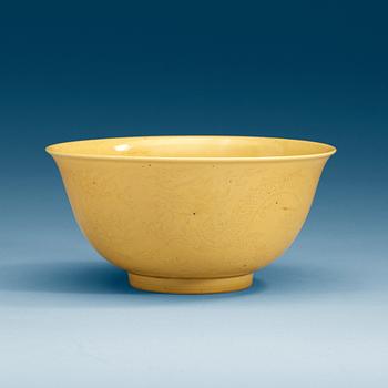 1824. A Chinese yellow glazed bowl, with Kangxi six character mark.