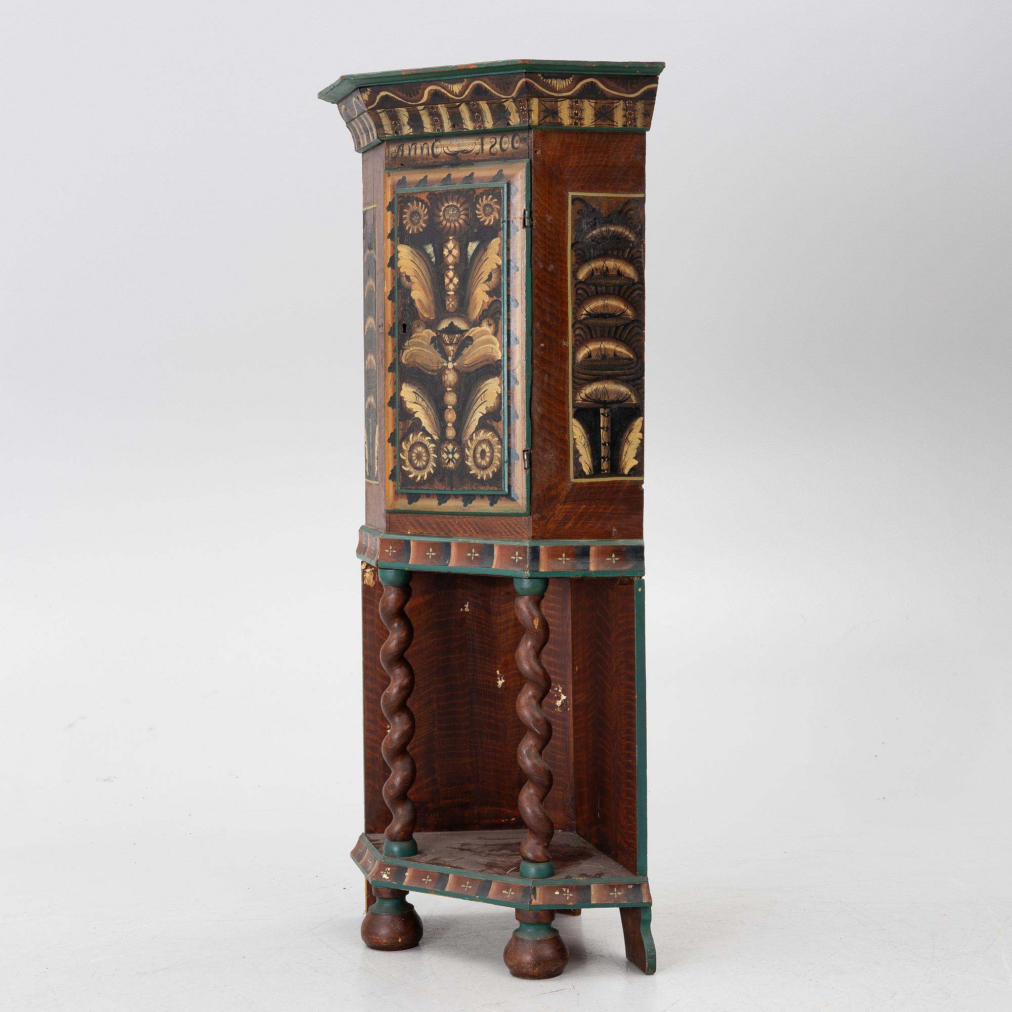 Corner cabinet, dated 1800.