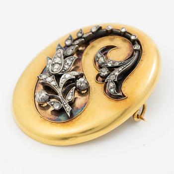 Brooch in silver and gold with rose-cut diamonds in the form of a plume, circa 1900.