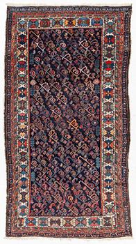 An oriental rug, c. 232 x 125 cm.