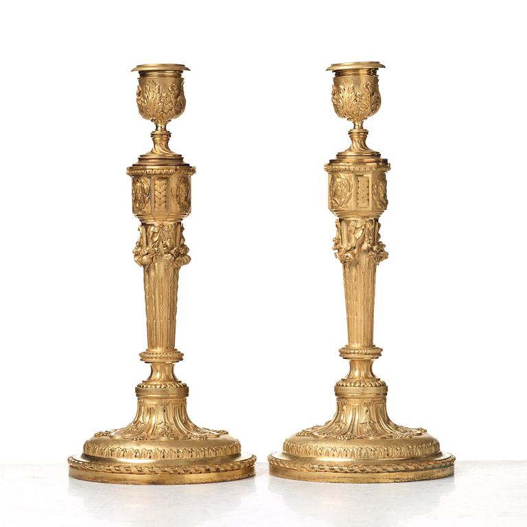 A pair of Louis XVI-style 19th century candlesticks by Raingo Frères, Paris.