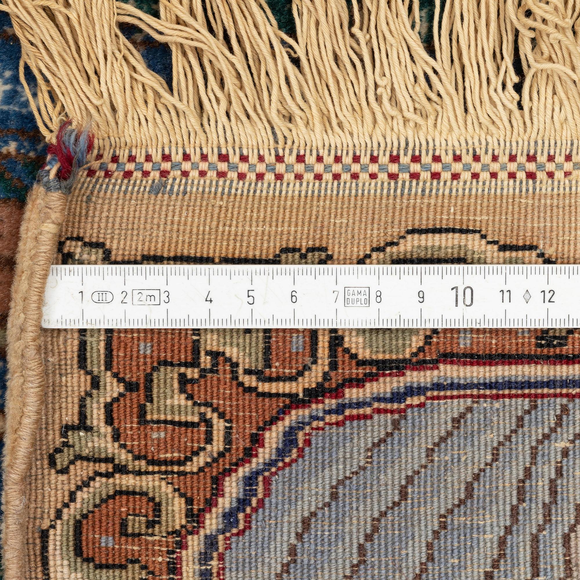 A pictoral Tabriz carpet of  'The Four Seasons', design, c. 293 x 178 cm.