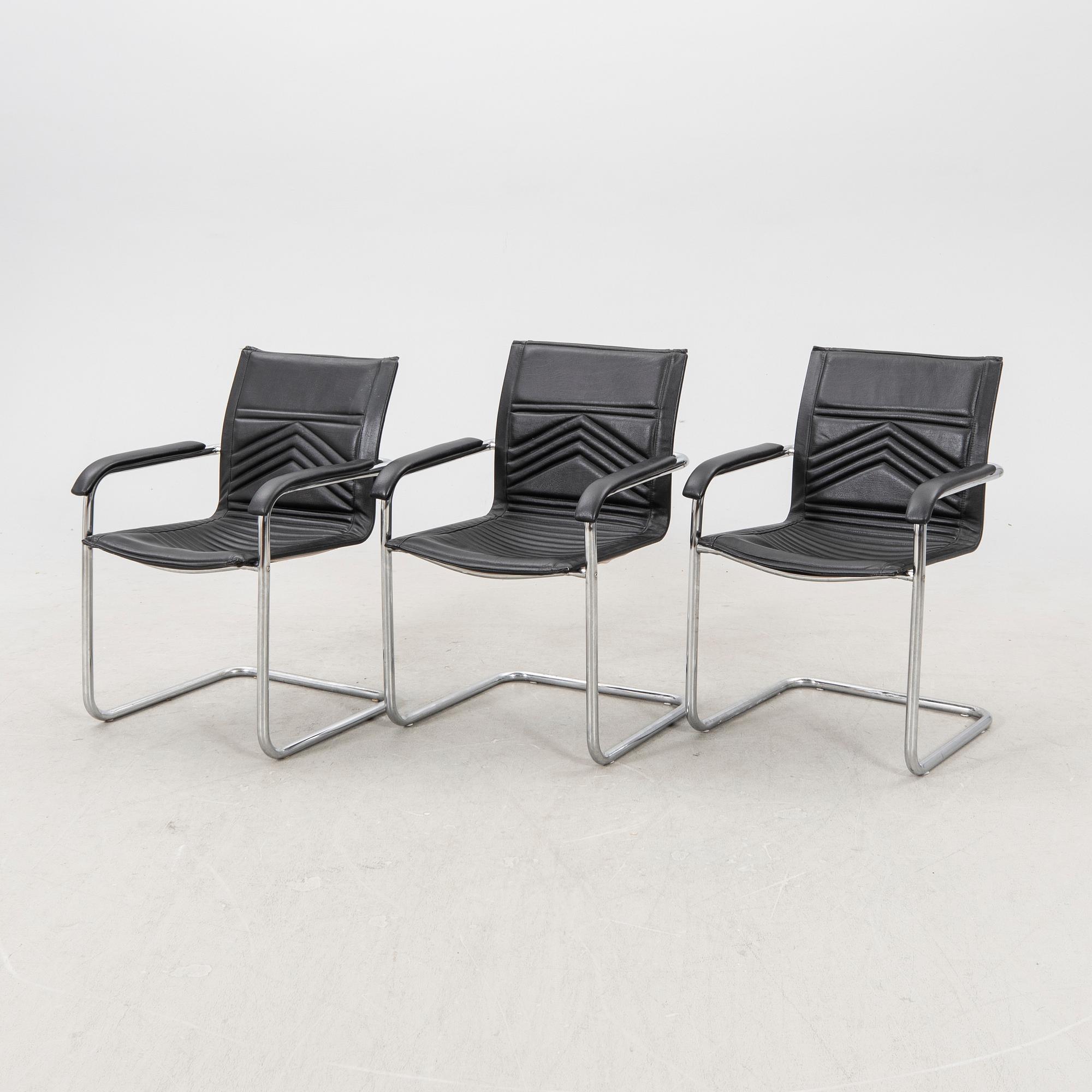 A set of five chrome and leather armchairs alter part of the 20th century.