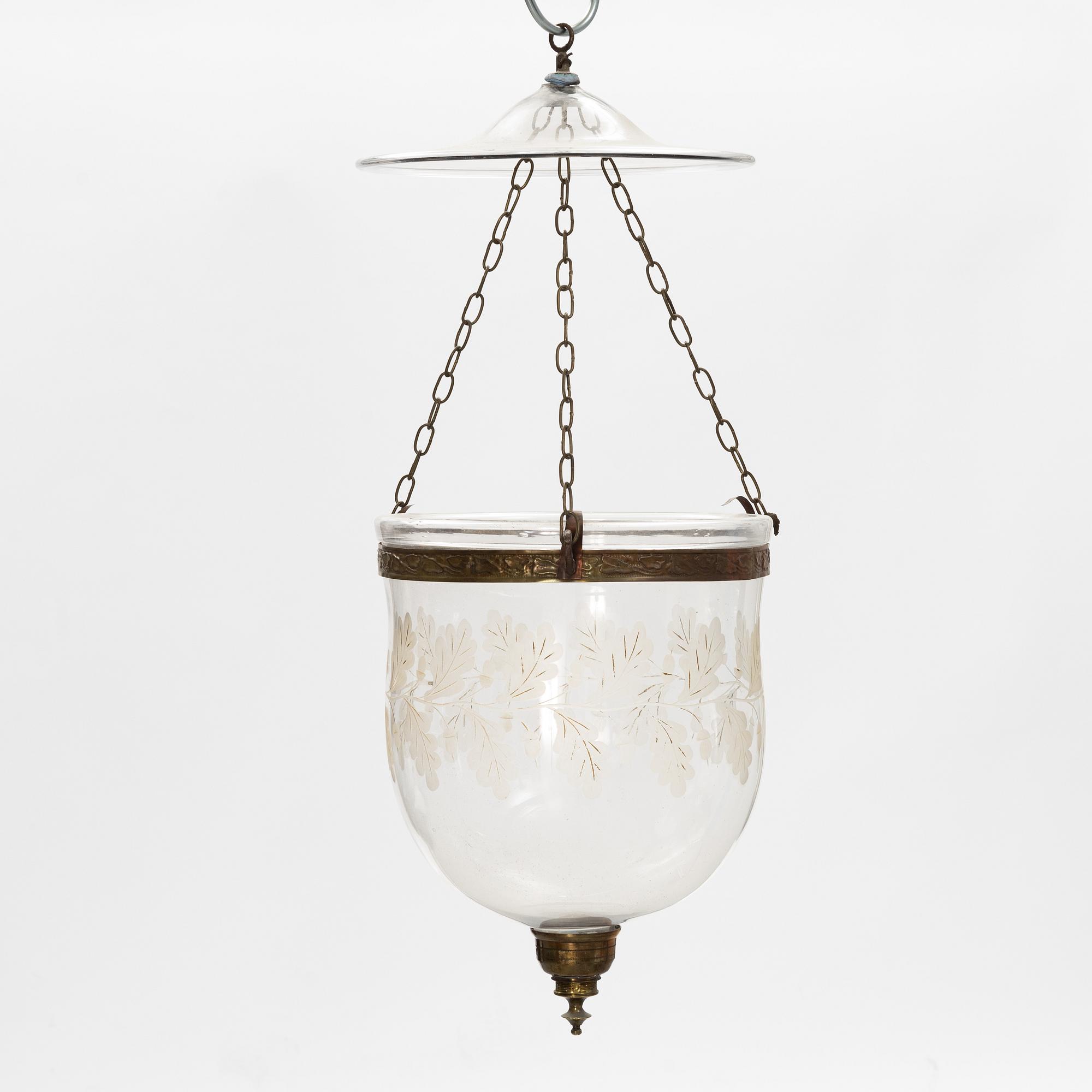 A glass and metal lantern, early 20th century.