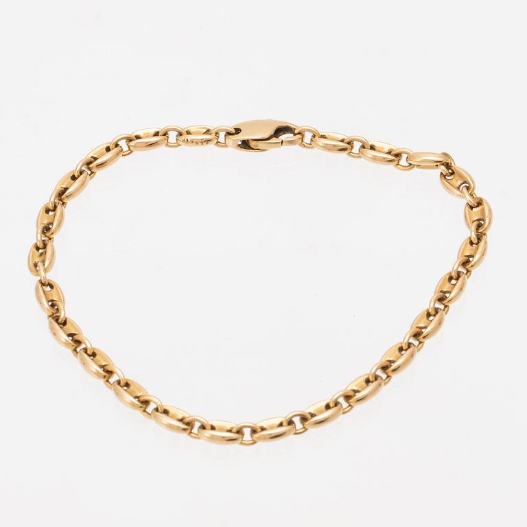 An 18K gold bracelet by Cartier.