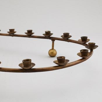 A mid 20th Century brass candle ring.