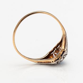 A 14K gold ring with diamonds ca. 0.02 ct in total and a sapphire. Finnish import marks.