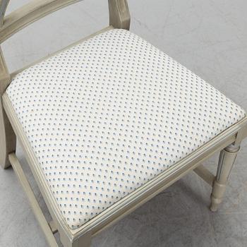 A dining table and six chairs, Gustavian style, second half of the 20th century. One leaf included.