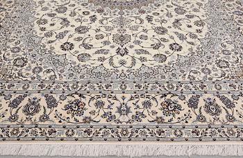 A Nain part silk carpet, 408 x 308 cm.