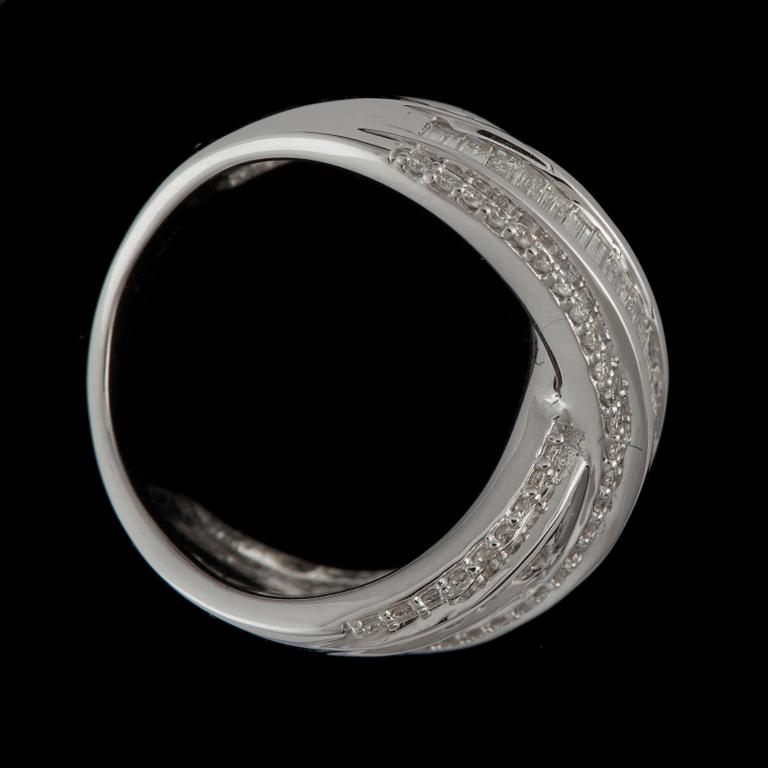 A brilliant- and baguette-cut diamond ring. Total carat weight circa 1.50 cts.