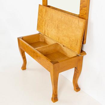 A mirror with console table, early 20th century.
