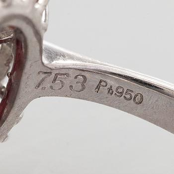 A platinum ring with spinel and brilliant cut diamonds.