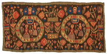 35. A carriage cushion, "the Annunciation", tapestry weave, ca 103 x 51 cm, south western Scania (Sweden), 1833.