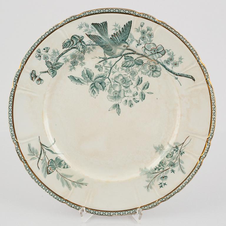 A 124-piece creamware dinner service, "Wexiö guld", Gustavsberg, Sweden, around 1900.