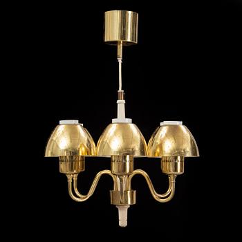 Hans-Agne Jakobsson, a 'T526' brass and wood ceiling light from Markaryd.