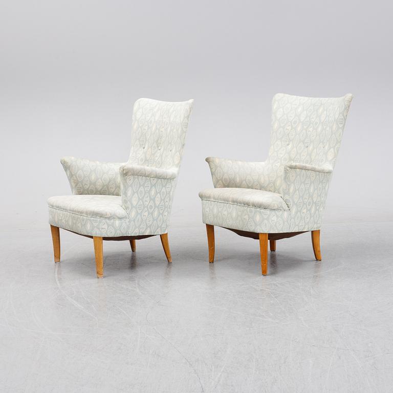 A pair of easy chairs by Carl Malmsten second half of the 20th Century.
