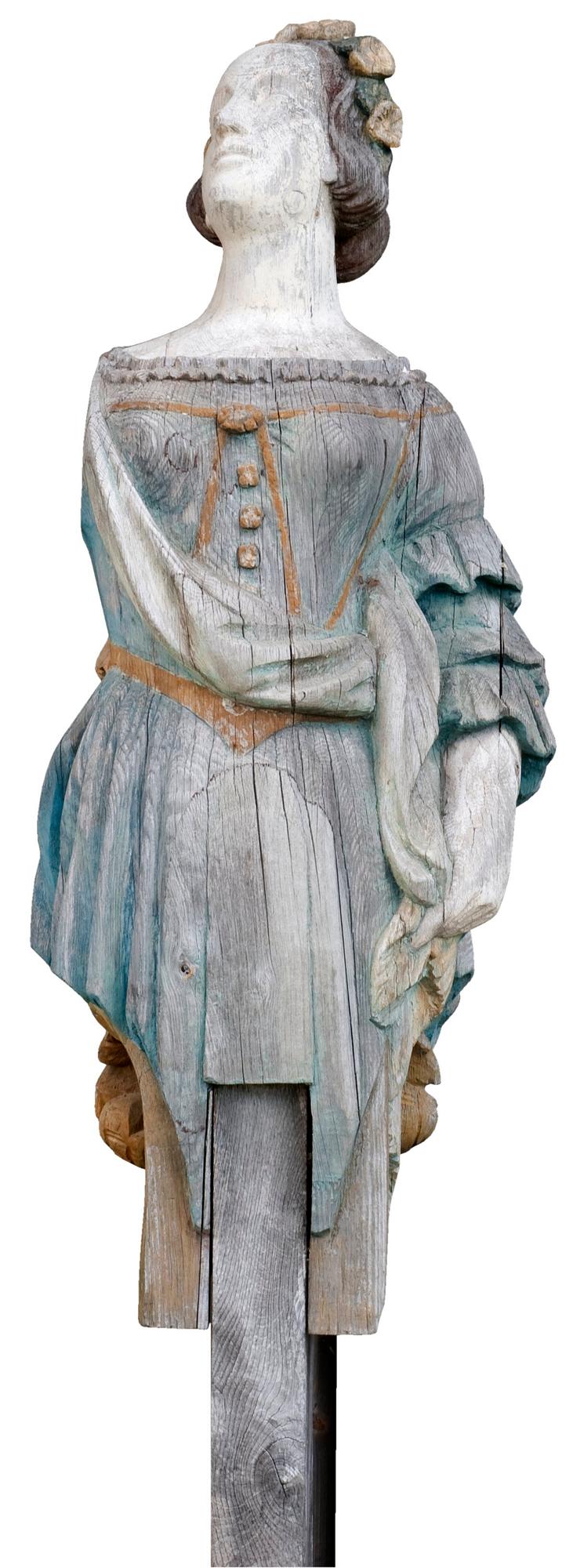A WOODEN FEMALE FIGURE HEAD,