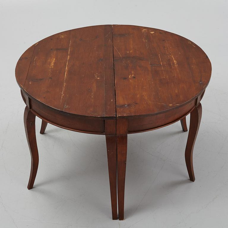 A stained pine table, 19th Century.