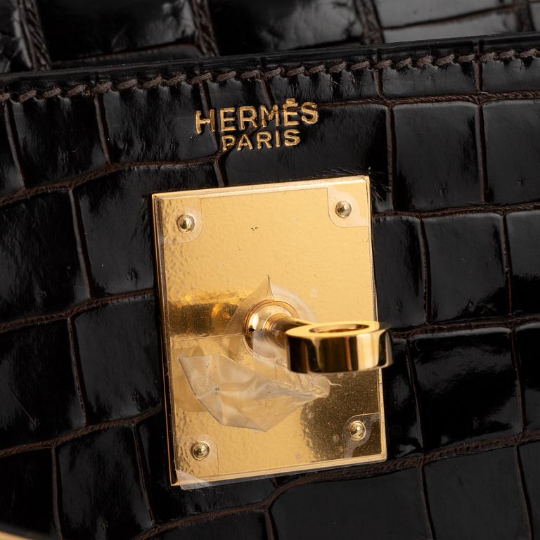 Hermès, A brown Alligator Mississippiensis "Kelly 28", 1964.