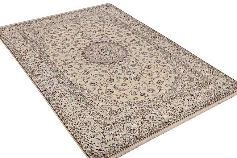 A Nain carpet, part silk, 6 laa, ca. 295 x 205 cm.