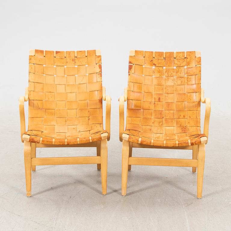 Two 'Eva' easy chairs by Bruno Mathsson for Firma Karl Mathsson dated 1964.