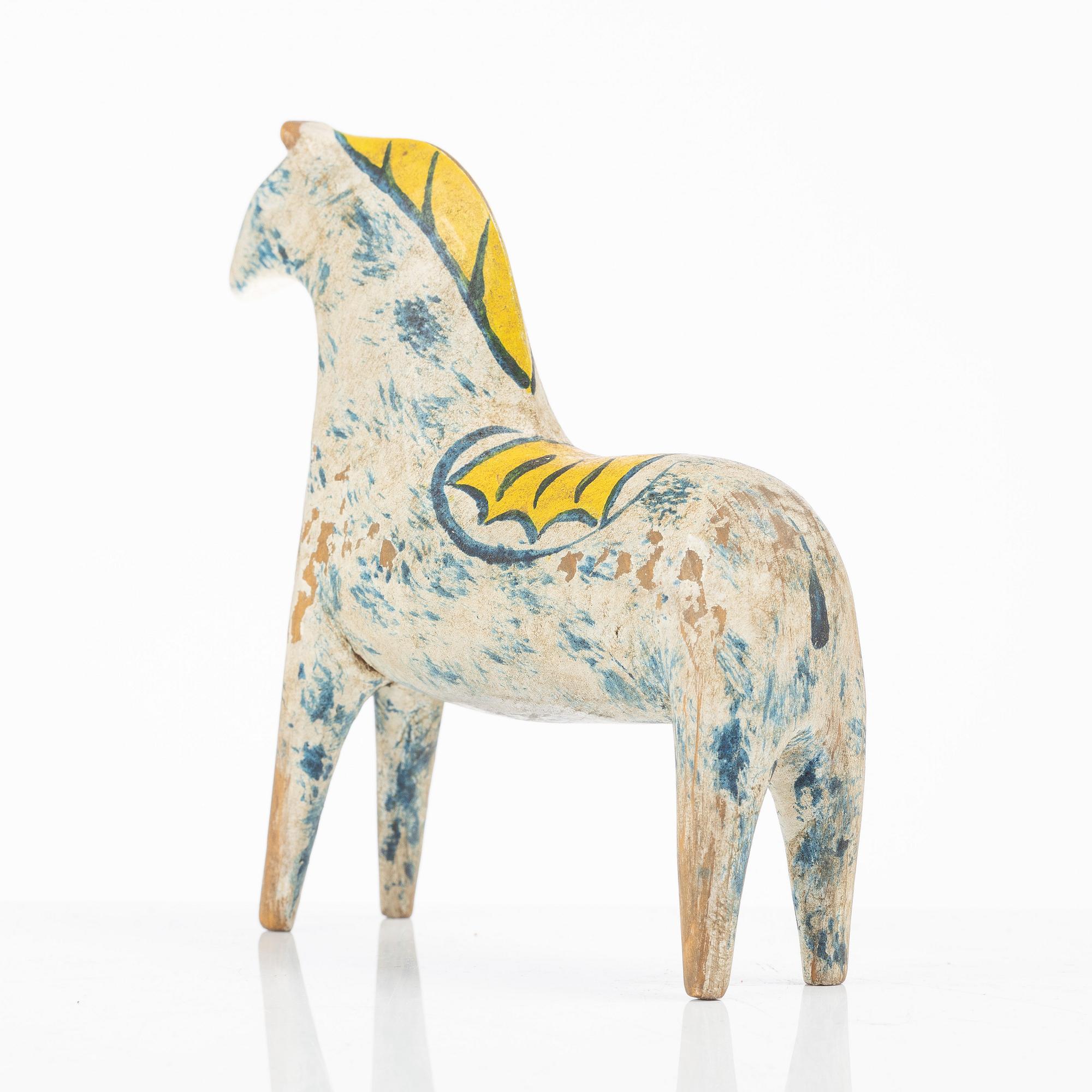 A carved and polychrome painted Dalecarlian horse, circa 1900.