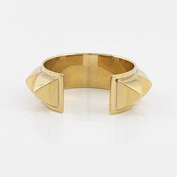 Hermès, a vintage gold tone stud bangle.