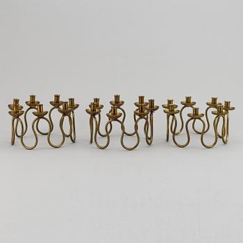 LARS HOLMSTRÖM, Three brass candelabra, Arvika, mid 20th Century.