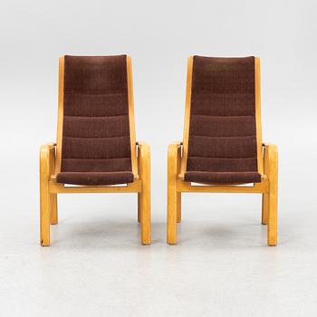 Yngve Ekström, a pair of armchairs, Swedese, late 20th century.
