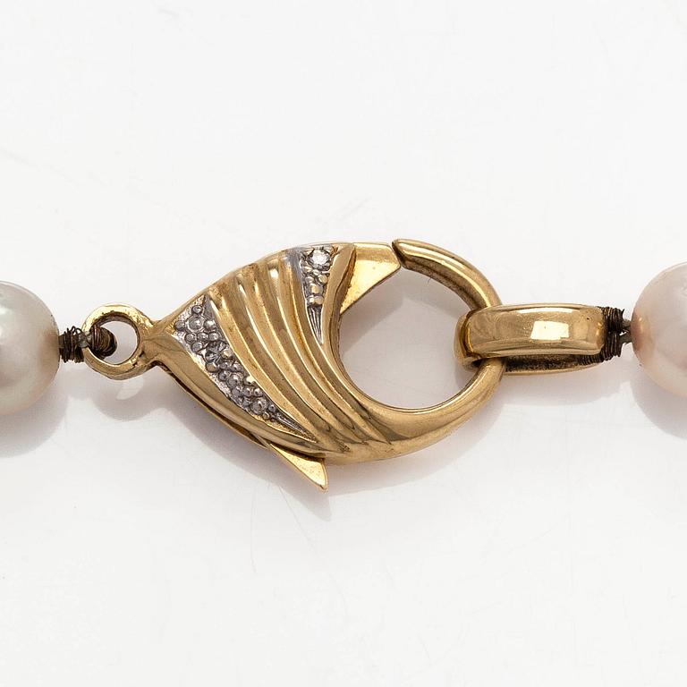 A cultured Akoya pearl necklace, clasp in 18K gold set with eight-cut diamonds. Swedish control mark.