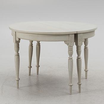 A late 19th Century painted dining table.