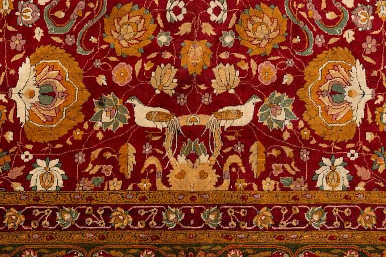An antique Lahore carpet, northern India (todays Pakistan), approx. 463 x 404 cm.
