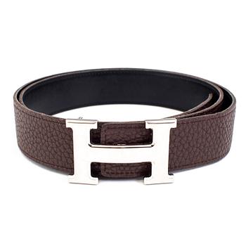 Brown togo belt "Constance" by Hermès.