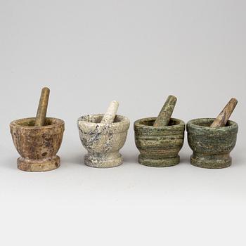 Four swedish green marble mortars and pestles, early 19th century.