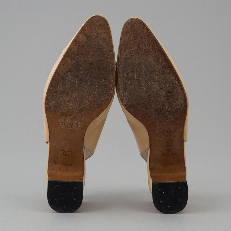 Beige leather slingbacks by Chanel.