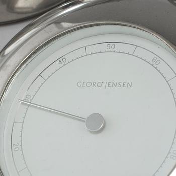 A wall clock, barometer and hydrometer, by Andreas Mikkelsen for Georg Jensen.