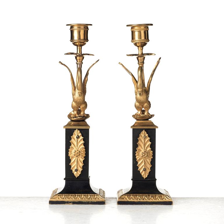 A pair of Empire early 19th century candlesticks.