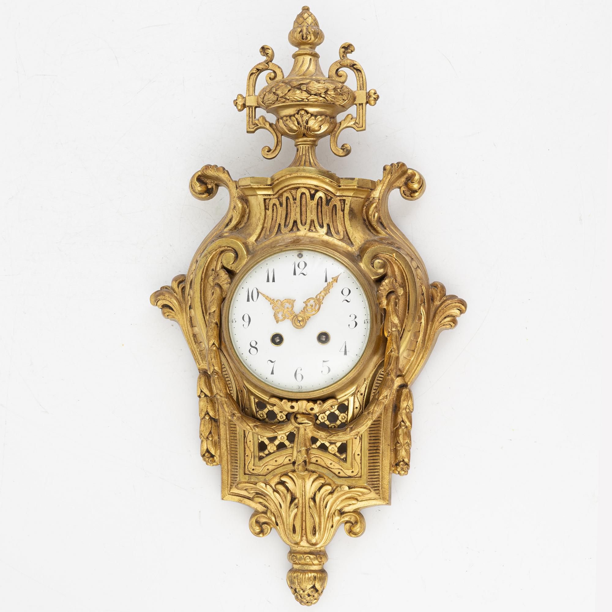 A Louis XVI-style wall clock, first half of the 20th Century.