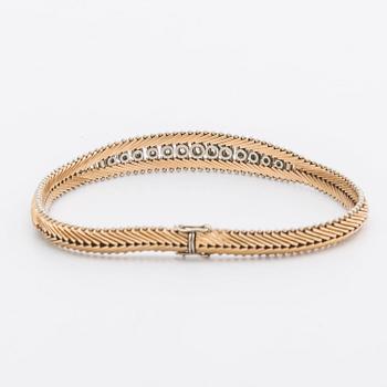 ARMBAND 18K guld m briljanter och diamanter 8/8 ca 0,65 ct totalt.