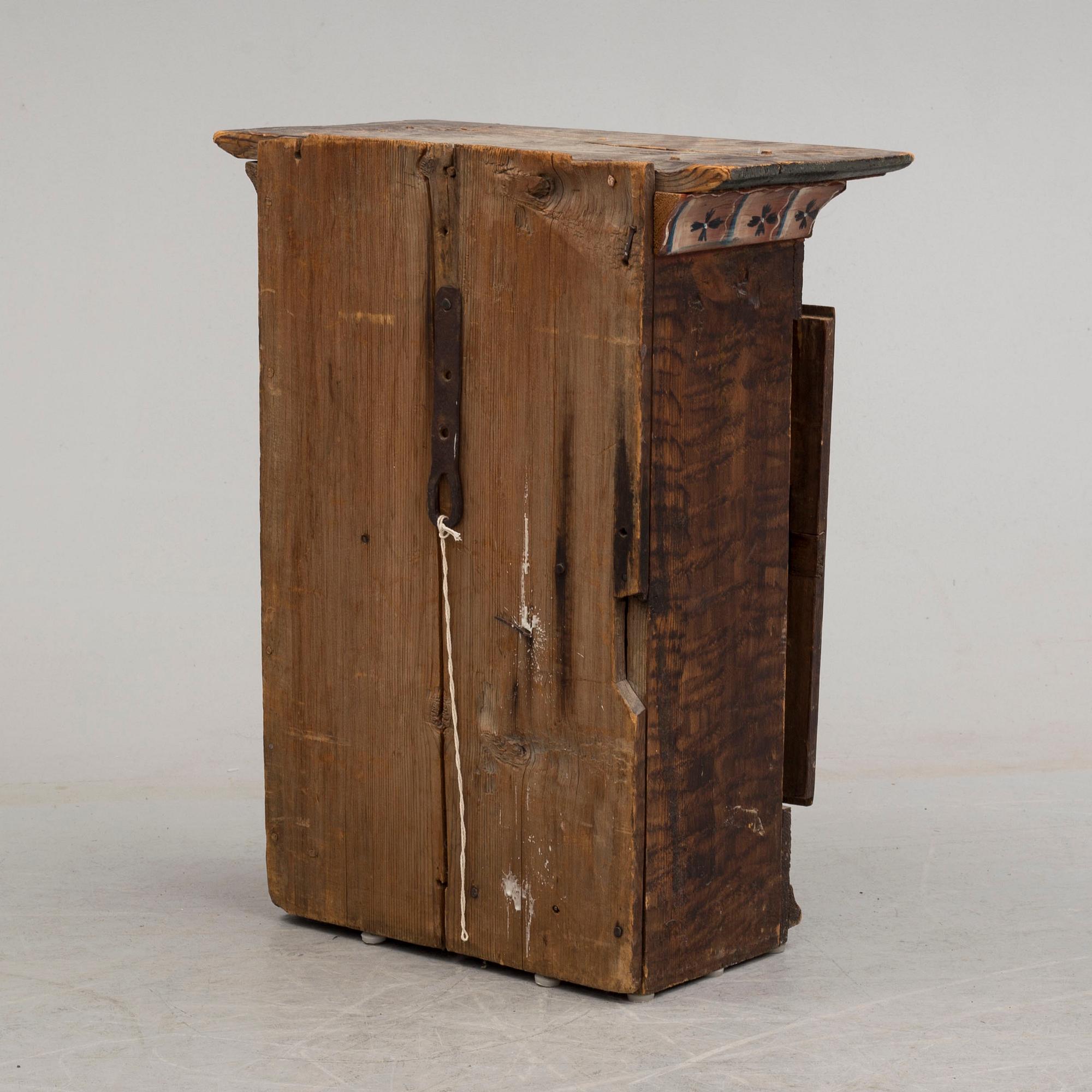 An early 19th century wall cabinet.