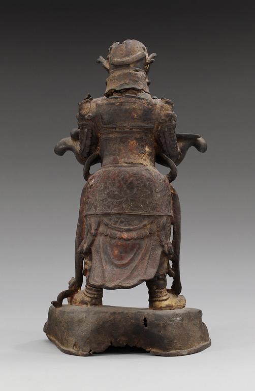 A gilt bronze figure of a warrior, Qing dynasty, 17th Century.