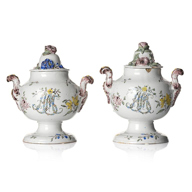 A pair of fainece potpurri jars with covers, Northern Europe, 18th century.