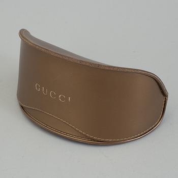 A pair of Gucci GG2970/S sunglasses with case.