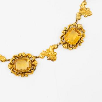 A necklace and a pair of earrings in 14K gold with faceted citrines.