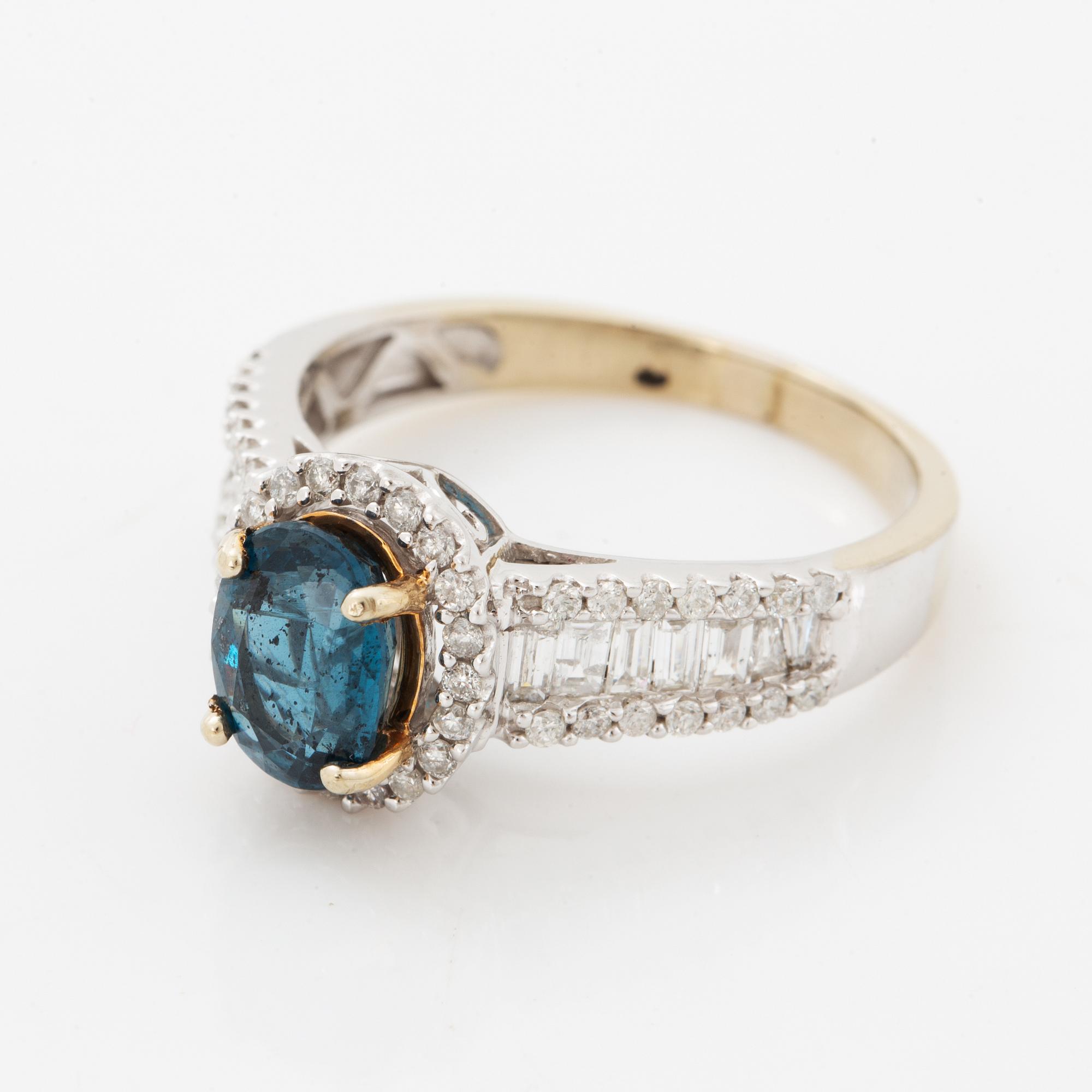Oval faceted kyanite and diamond ring.