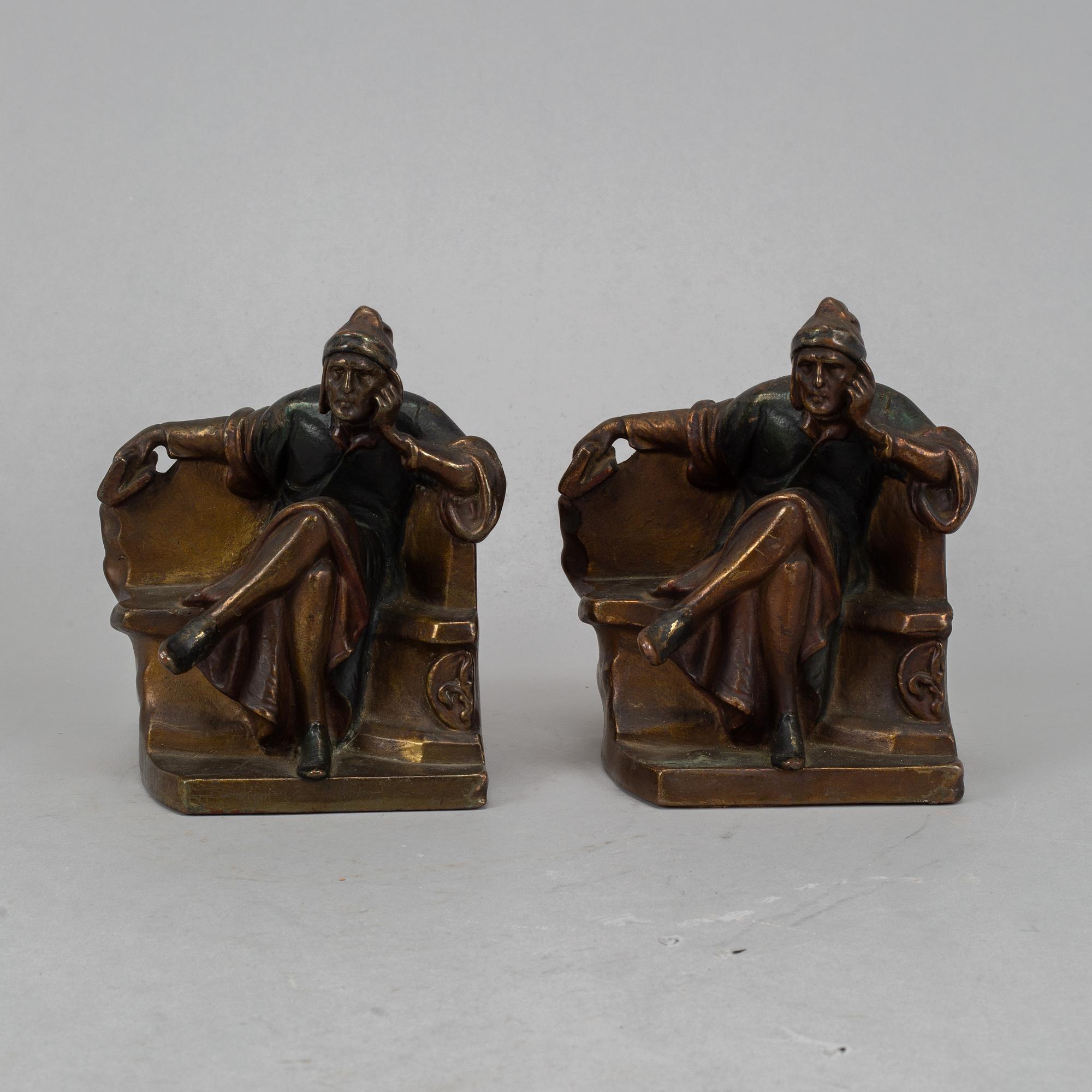 Two brass book ends, 20th century.