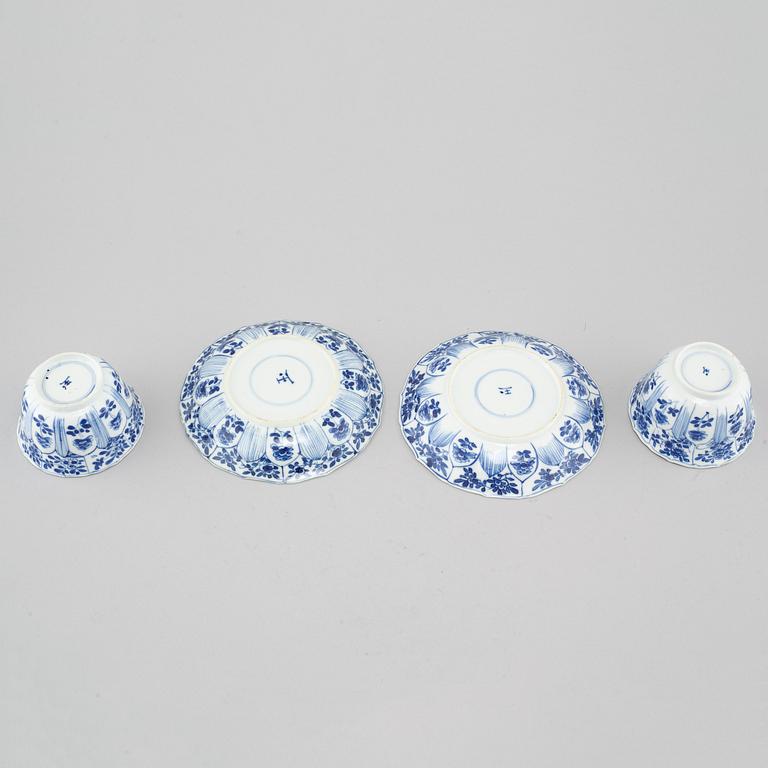 A pair of Kangxi  (1662-1722) Chinese porcelain cups with saucers.