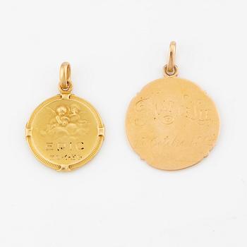 Two 18K gold medallions.