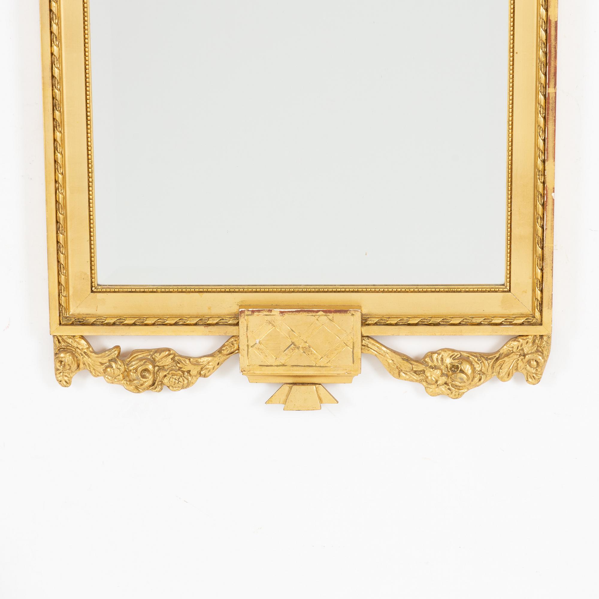 A Gustavian style console table and mirror, mid 20th century.