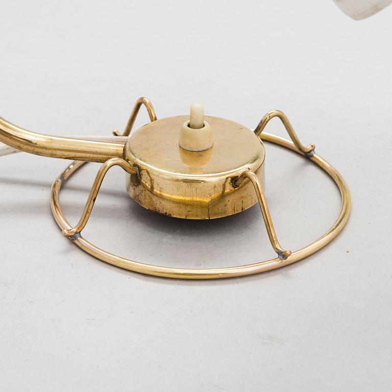 A mid-20th-century table lamp
/wall light for Idman.